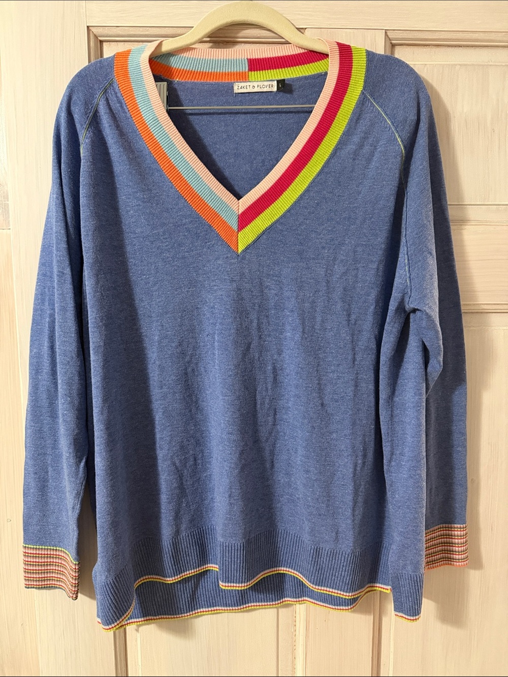 Blue V-Neck Sweater with Rainbow Ribbed Trim